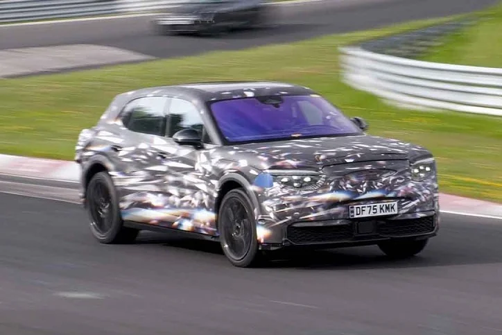 Electric Bentley SUV with heavy camo spotted testing at Nürburgring